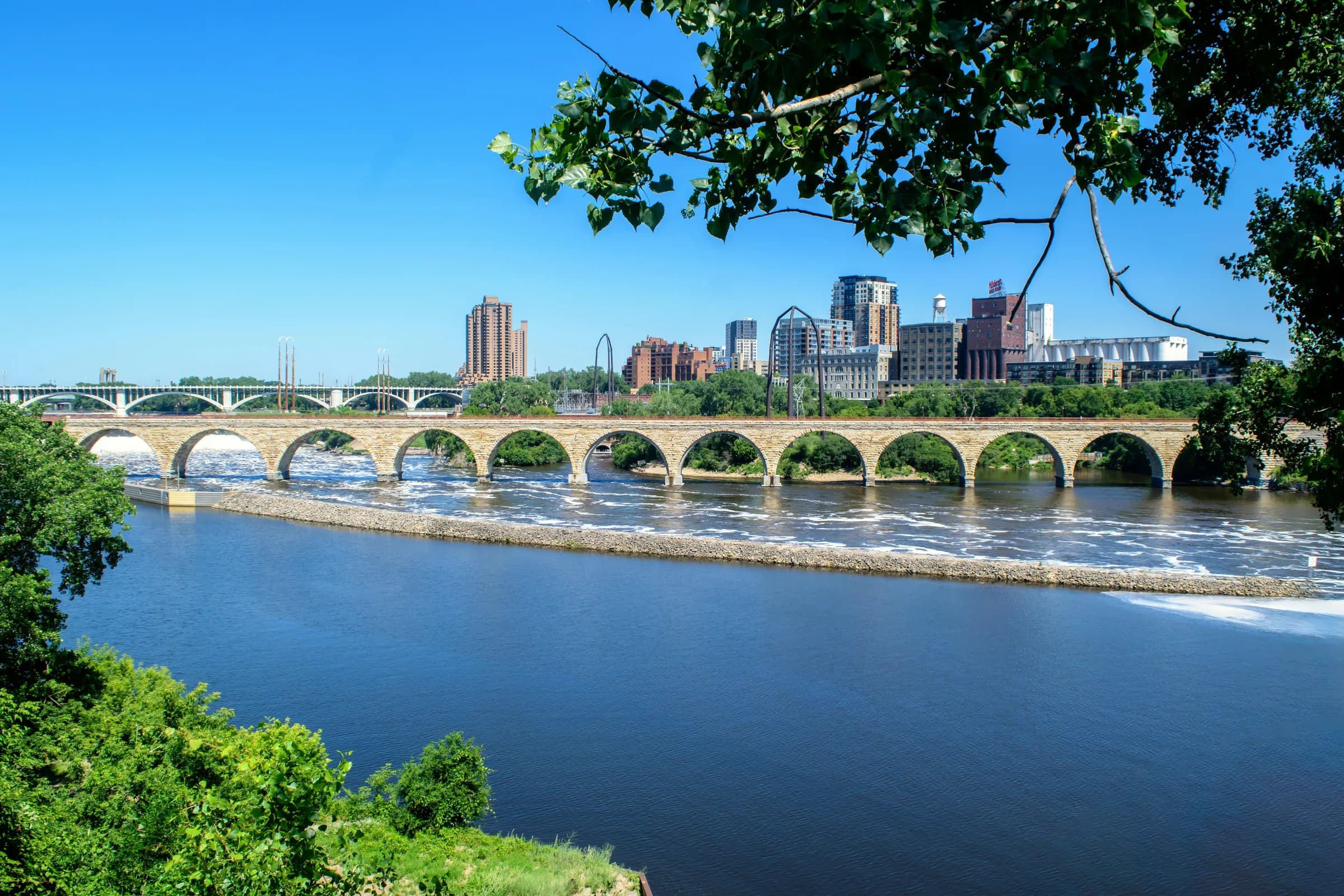 Stone Arch Bridge over the Mississippi with the Minneapolis skyline